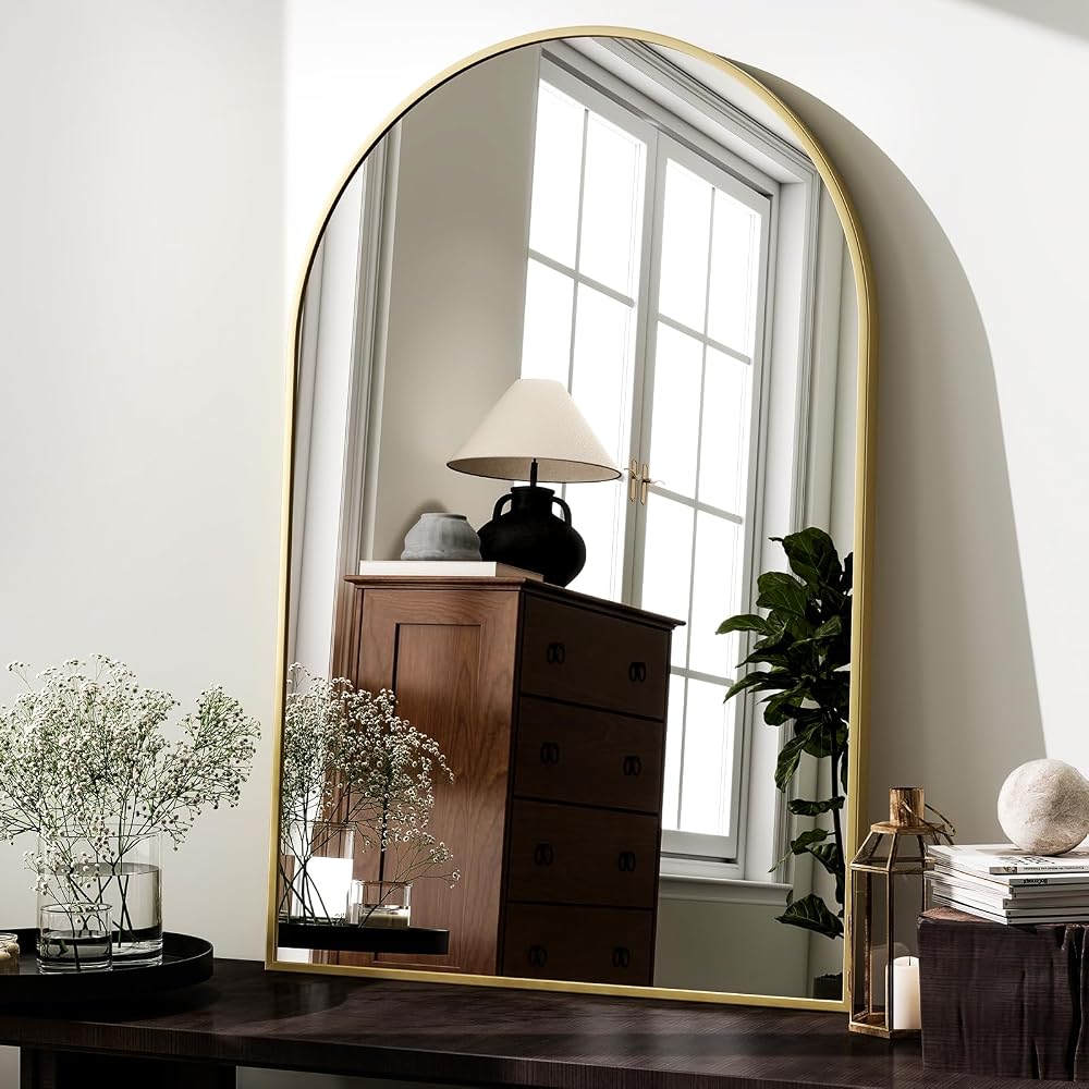 Arched gold wall mirror, 24 by 36 inches